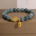 Natural stone bracelet with blue beads, lotus pendant, and adjustable leather strap