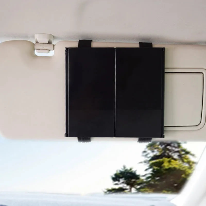 Silver car folding makeup mirror shown closed at 15.5 cm and opened at 30.5 cm wide.