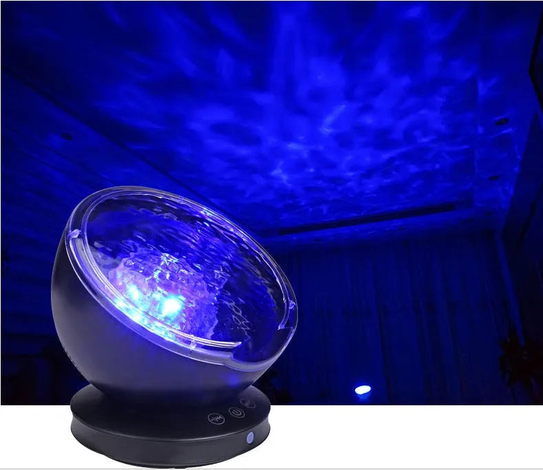 White and blue ocean wave projector LED night light with remote control, measuring 13x12x12 cm