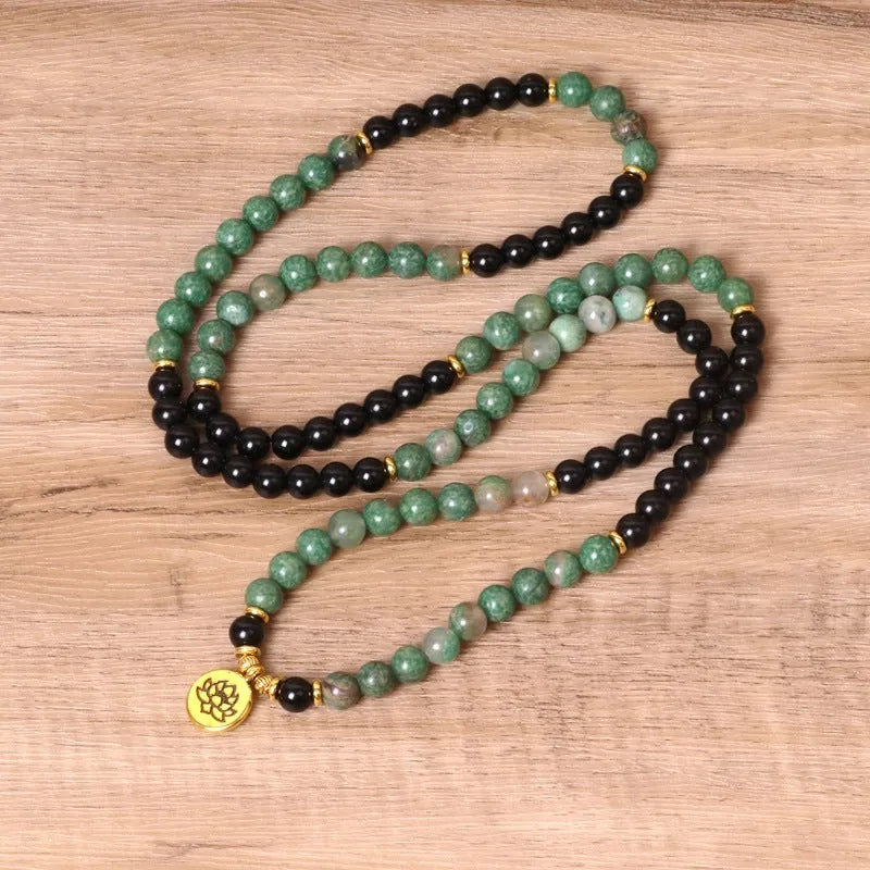 Green and black elastic beaded long bracelet with alloy beads on stretch cord
