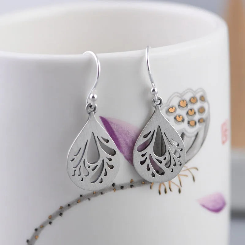 Pair of retro-style hollow water drop earrings made from 925 sterling silver