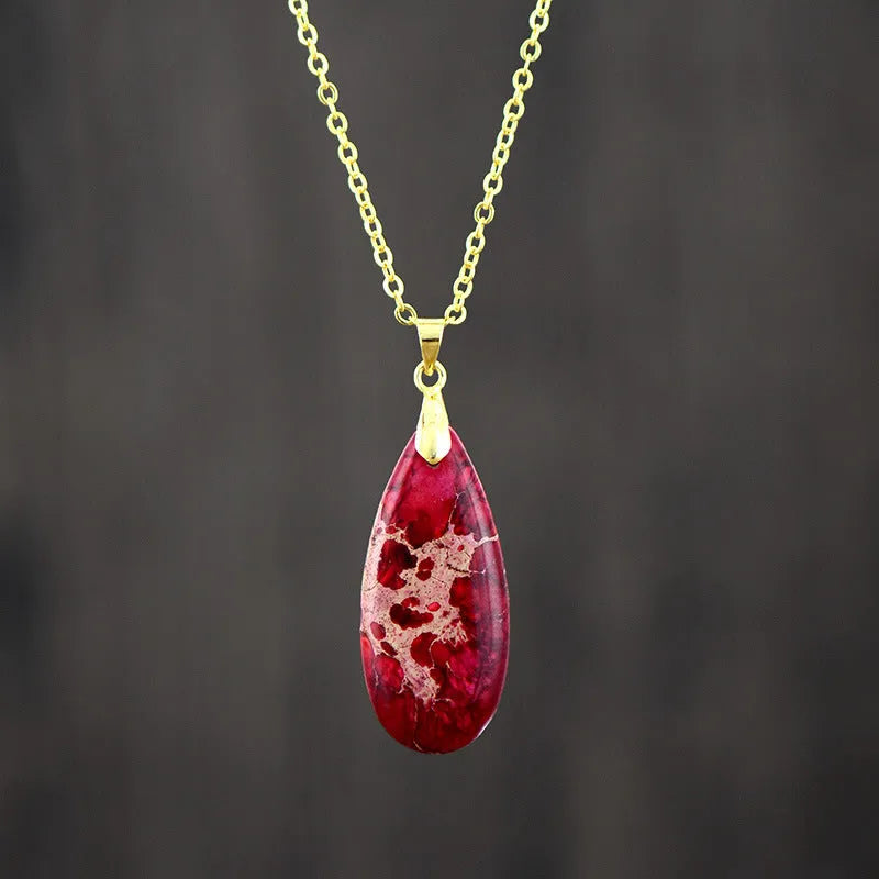 Emperor Stone jade pendant necklace on an 18k gold plated chain with a water drop shape.