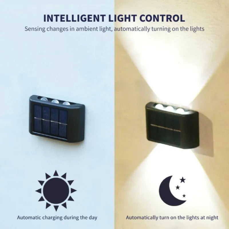 Black solar outdoor garden wall light with up and down glowing effect on a brick wall at night