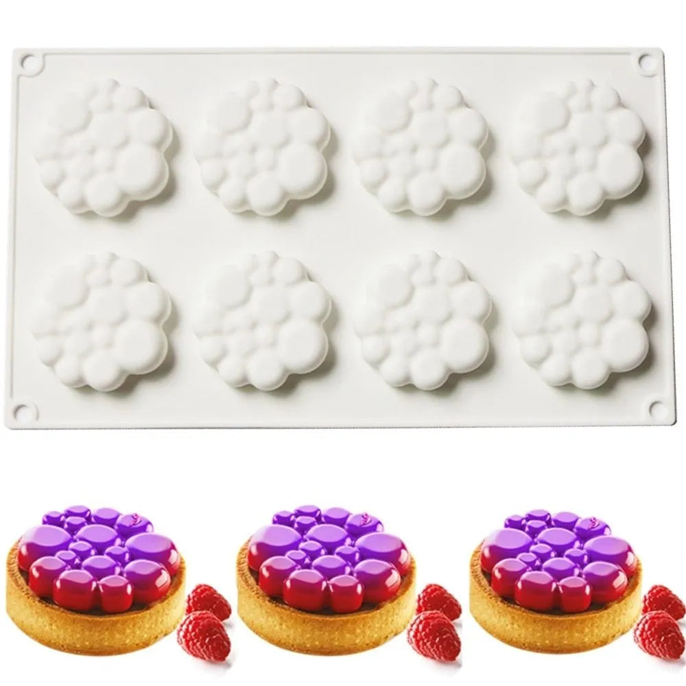 Round silicone baking mould with 8-bubble patterned base for cakes and desserts.