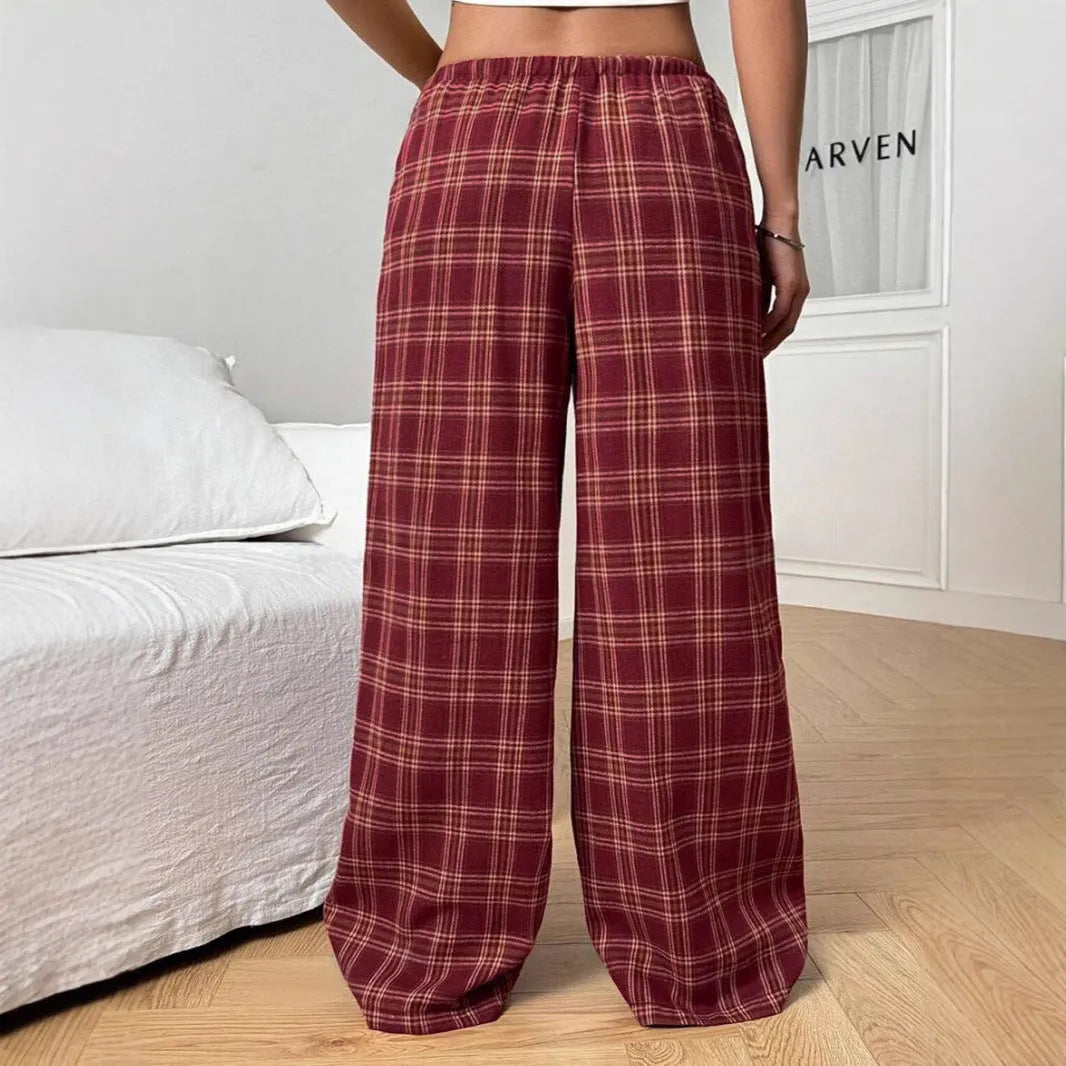 Women's loose plaid trousers with drawstring waist and side pockets in red or blue colour options