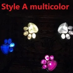 Black solar powered animal paw print garden lights with four paw-shaped LED lamps