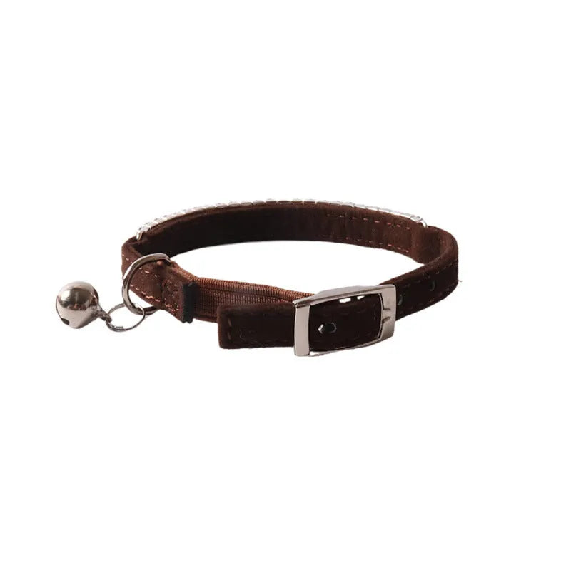Soft flocked cat collar with an elastic buckle shown in multiple colours.
