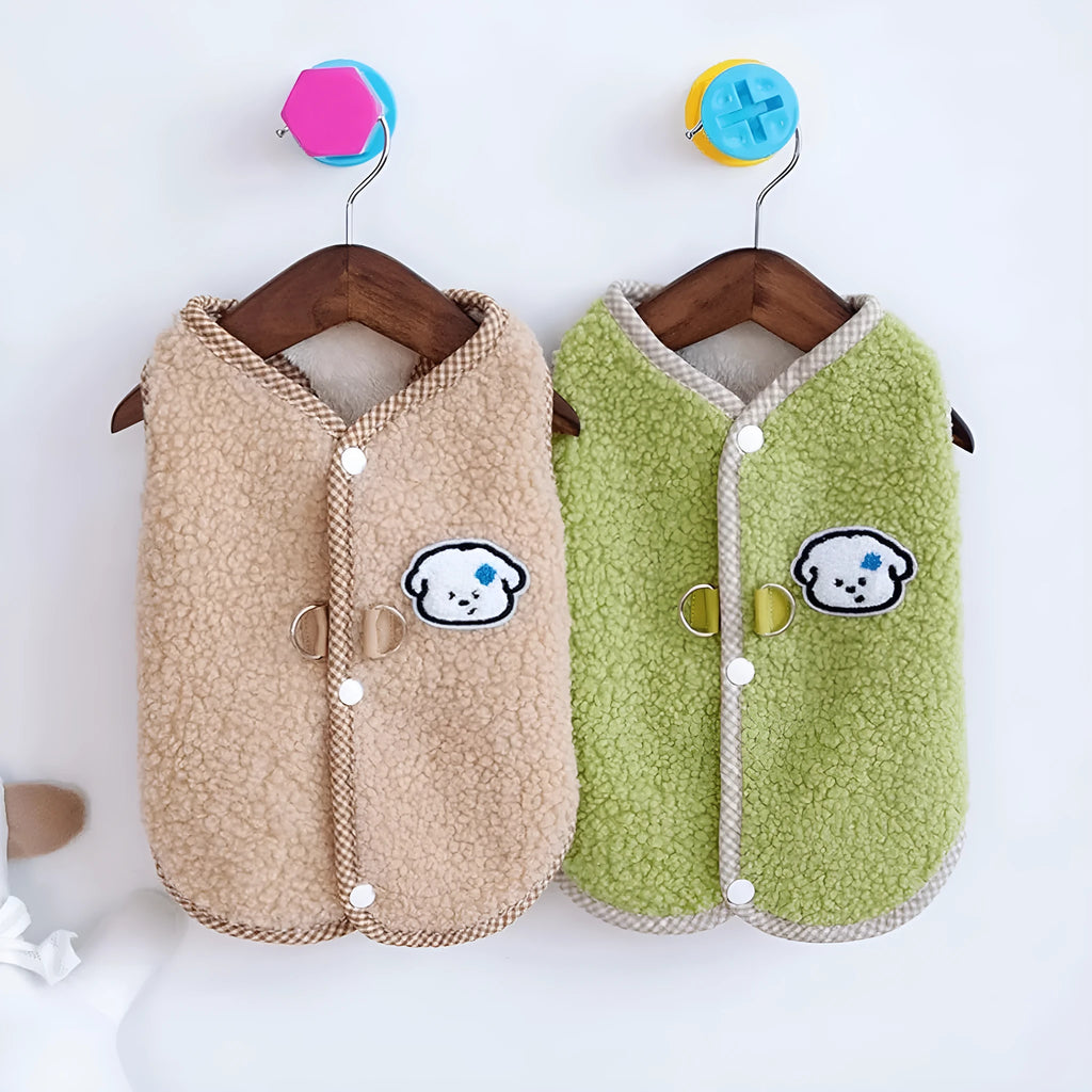 Green coral fleece dog vest with a leash ring on a small dog.