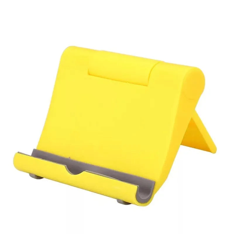 A black PE plastic folding stand holding a mobile phone at an angle.