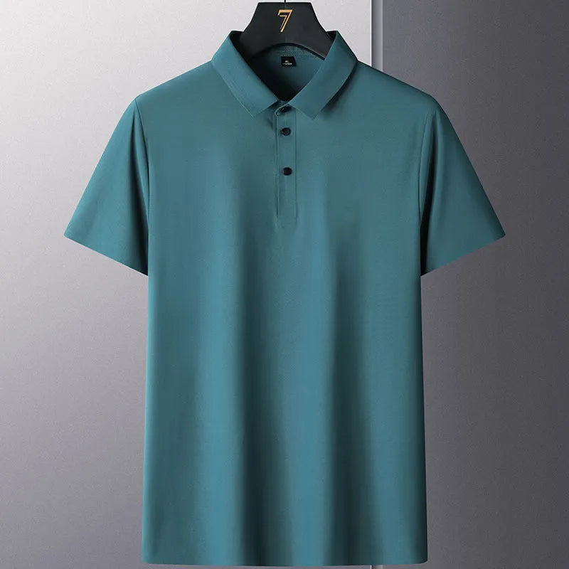 Man wearing a solid colour non-ironing business casual short sleeve shirt in a light blue shade.