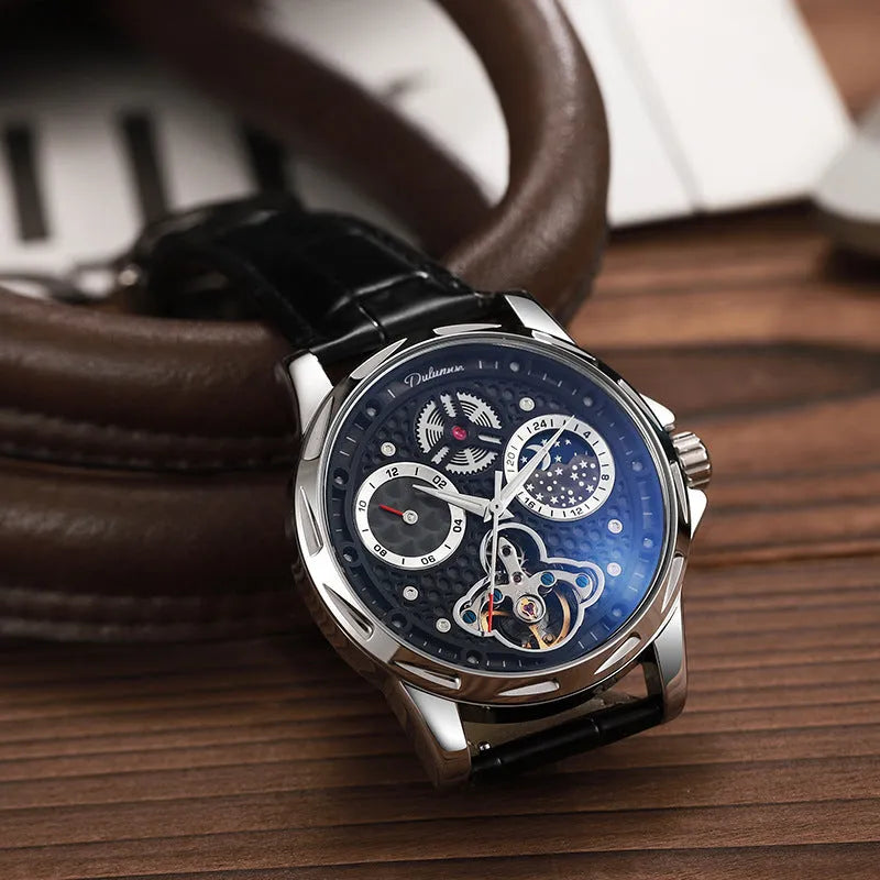 Men's automatic business watch with luminous hands on a steel bracelet, showing a black dial.