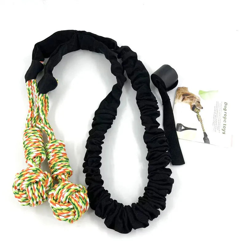 Long black cotton rope dog tug toy for chewing and interactive play.