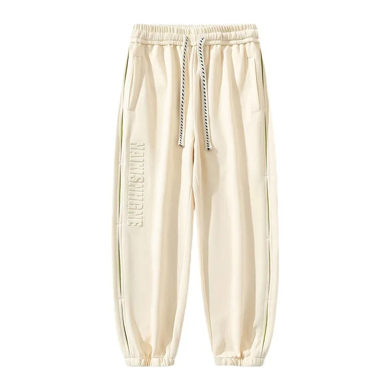Men's cotton pants with ankle banded design and stitching details in black colour