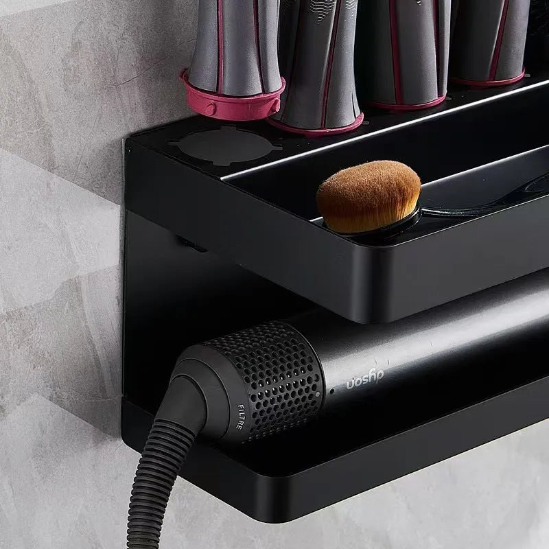 White double-layer aluminium wall rack holding hair curlers, mounted punch-free on a tiled bathroom wall.
