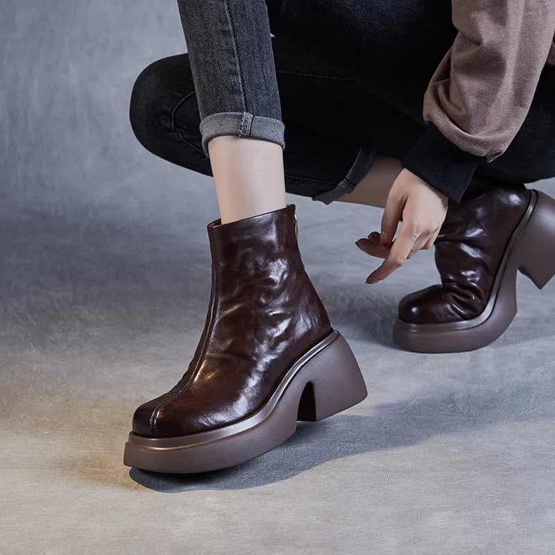 Women's chunky heel ankle boots in black with thick bottom, rubber outsole, and cotton cowhide upper
