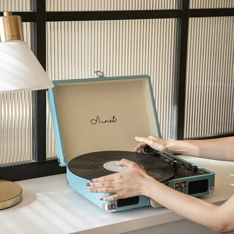 Retro phonograph Bluetooth record player in leather suitcase case with turntable and controls