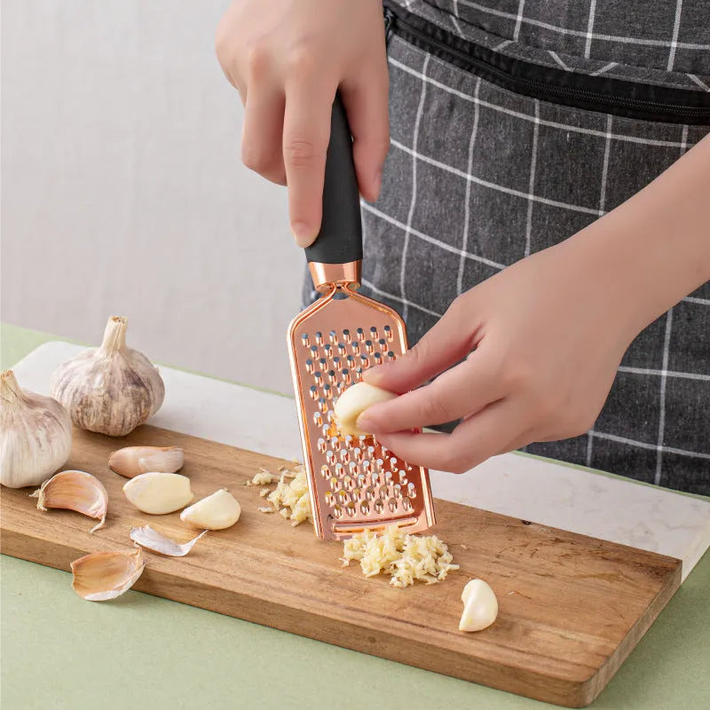 Seven-piece stainless steel kitchen utensil set with rose gold accents in six colour options on countertop