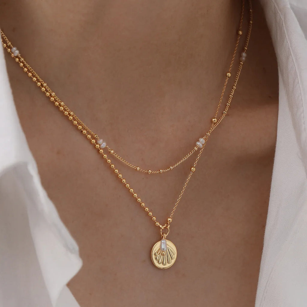 Hong Kong style necklace with natural pearl and shell pendant on stainless steel chain