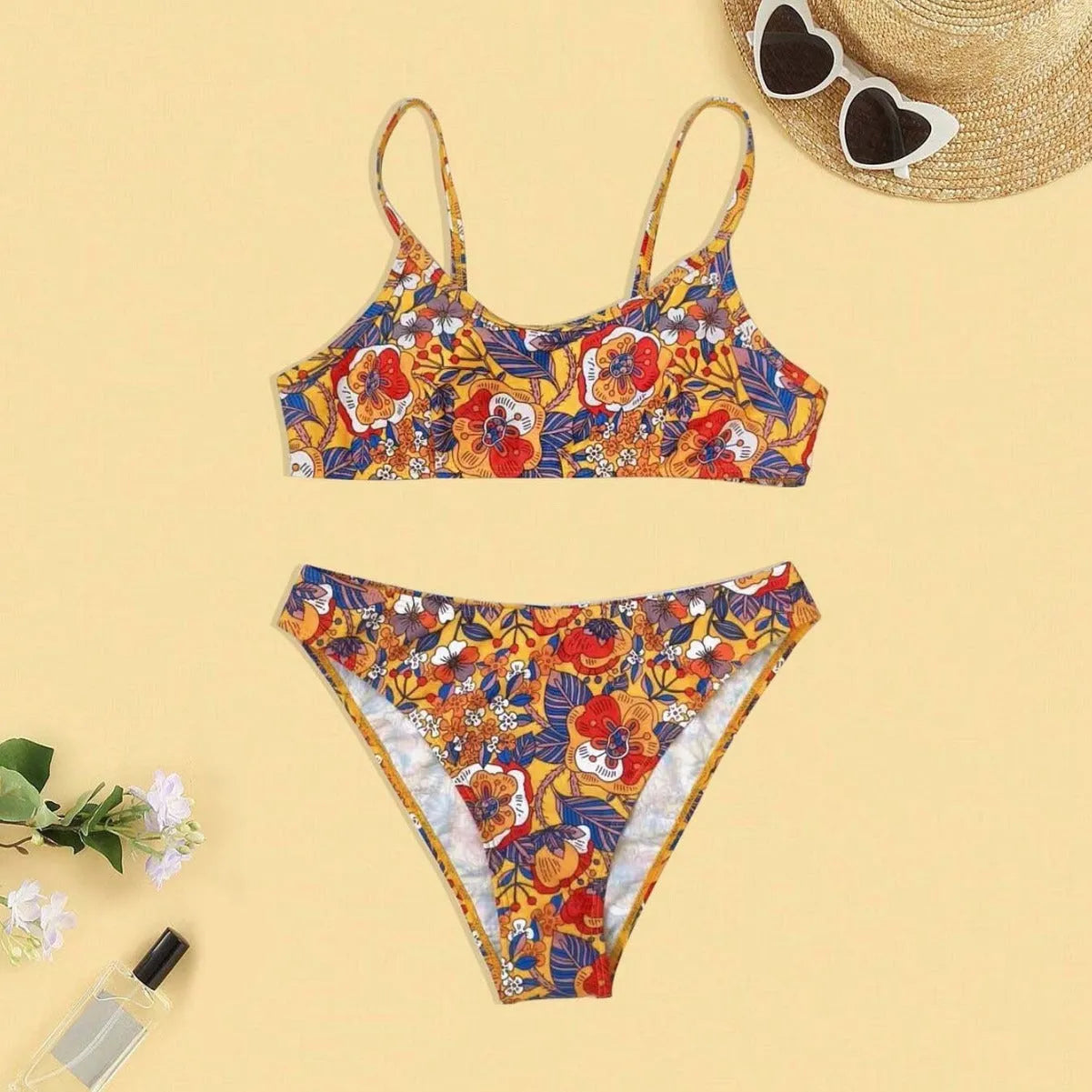 Plus size women's floral print bikini set with strapped design and brief style
