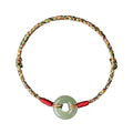 Colourful braided rope bracelet with silver peace buckle on woven wristband