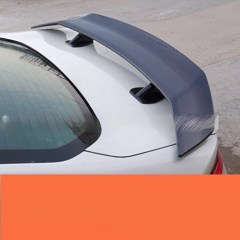 Universal punch-free ABS car spoiler in bright black, carbon, white, and blank finishes.