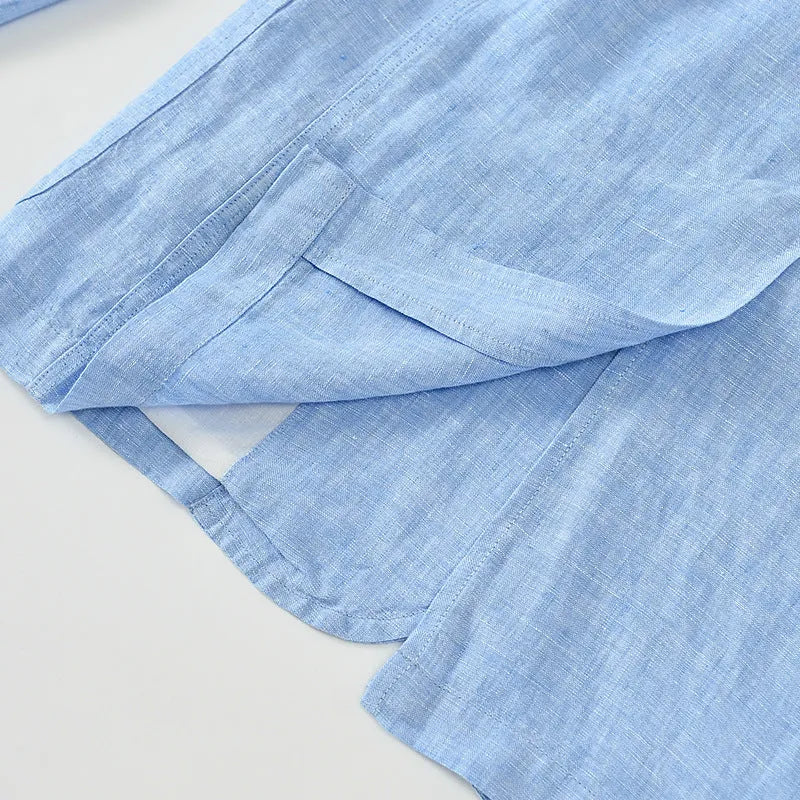 Men's solid colour linen suit jacket on a hanger, showing single-breasted front and size stick pocket detail.