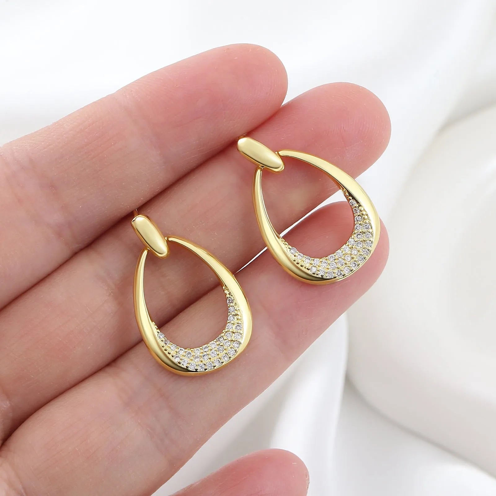 Yellow gold geometric ring drop earrings with electroplated finish on copper, 2.6 x 1.7 cm dimensions