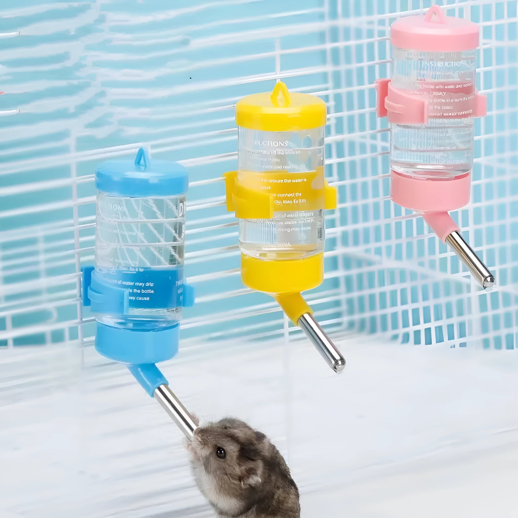 Green plastic ball kettle pet water feeder with leak-proof design mounted on a cage.