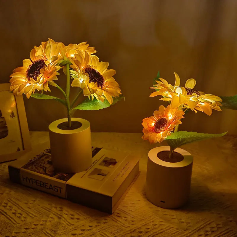 Rechargeable sunflower LED night light with artificial flower design on table