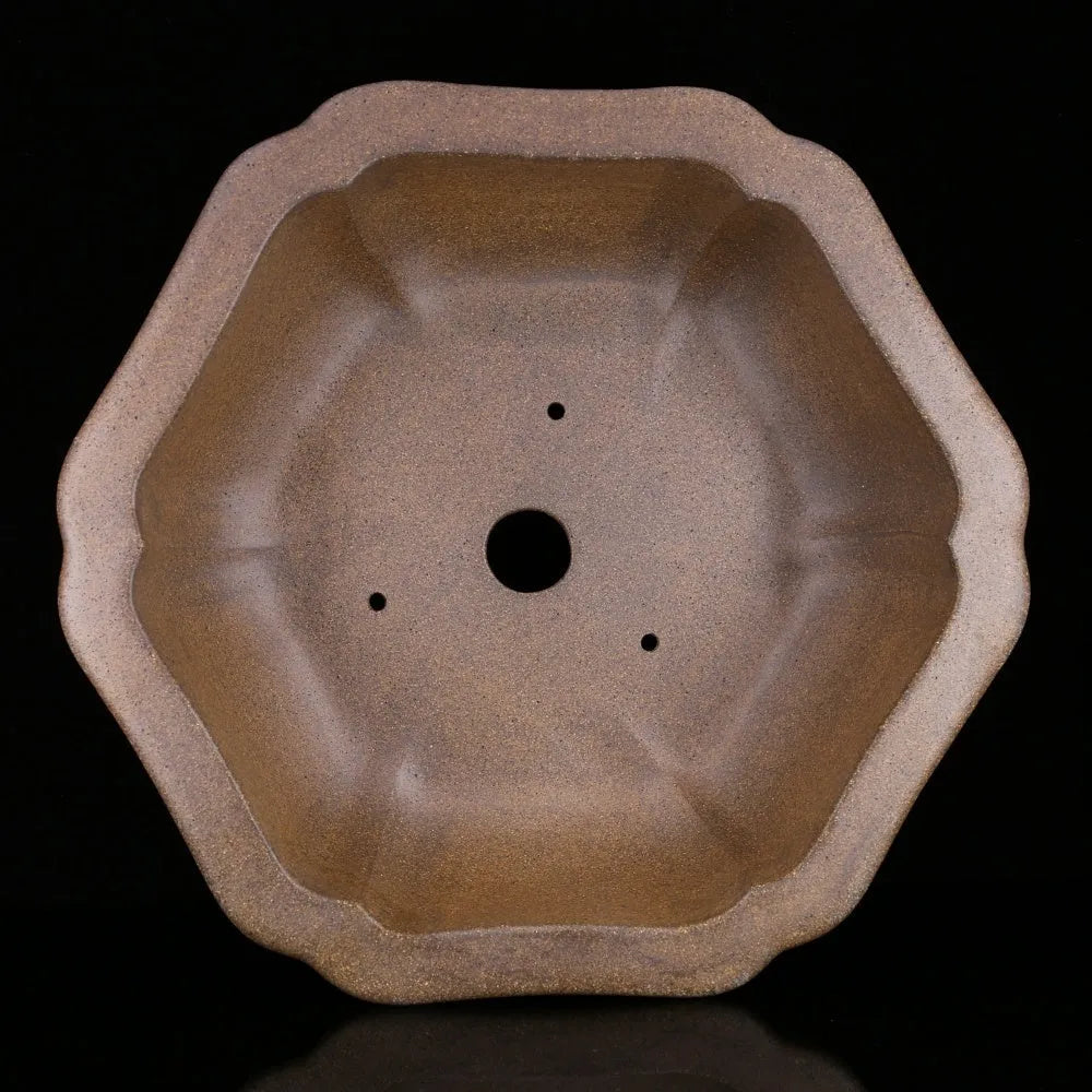 Handmade purple sand tea basin crafted from Pinus taiwanensis firewood clay in hexagonal or begonia styles