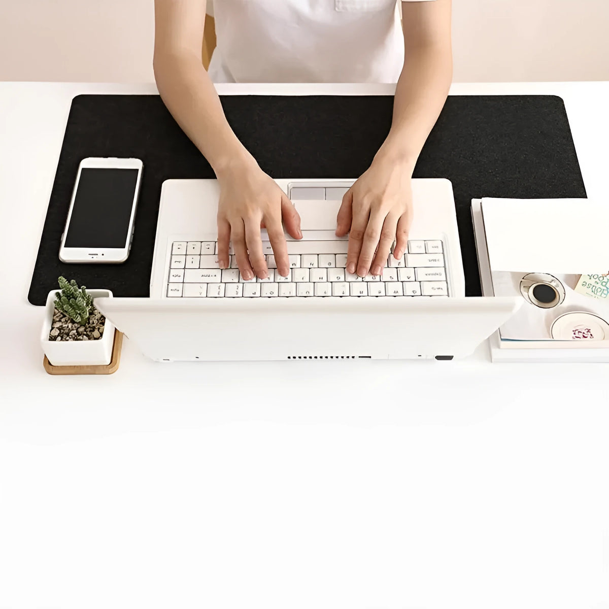 Large black felt desk mat with sewn edges, measuring 325x635mm, on an office desk with a keyboard and mouse.
