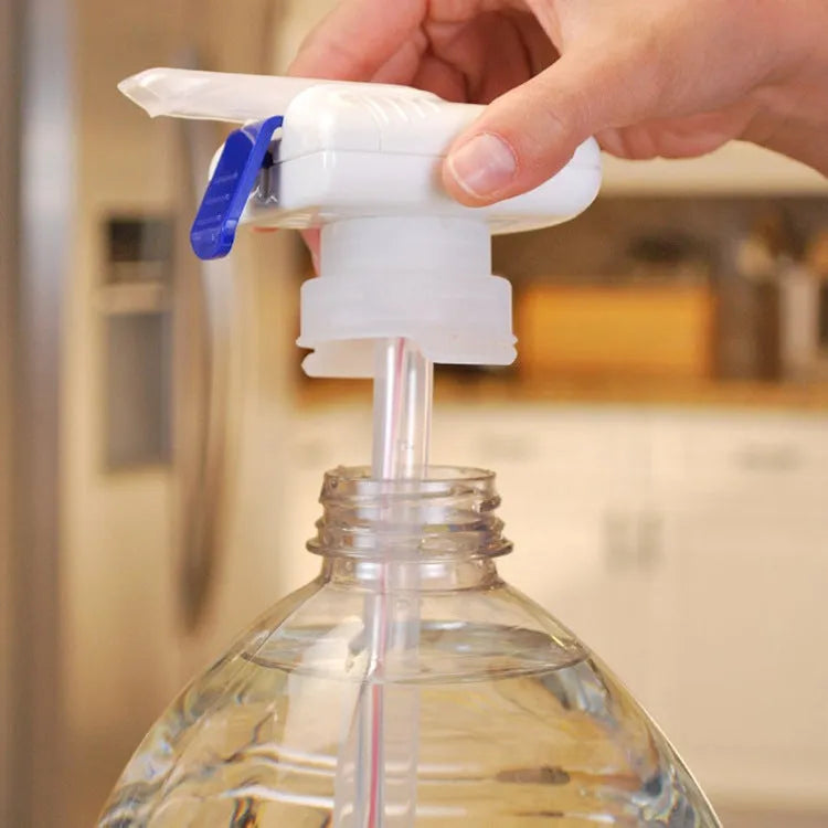 Manual beverage pumping device with long straw and blue press handle on a colour box.