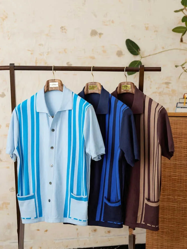 Royal blue striped cotton cardigan polo shirt with lapel collar and short sleeves laid flat
