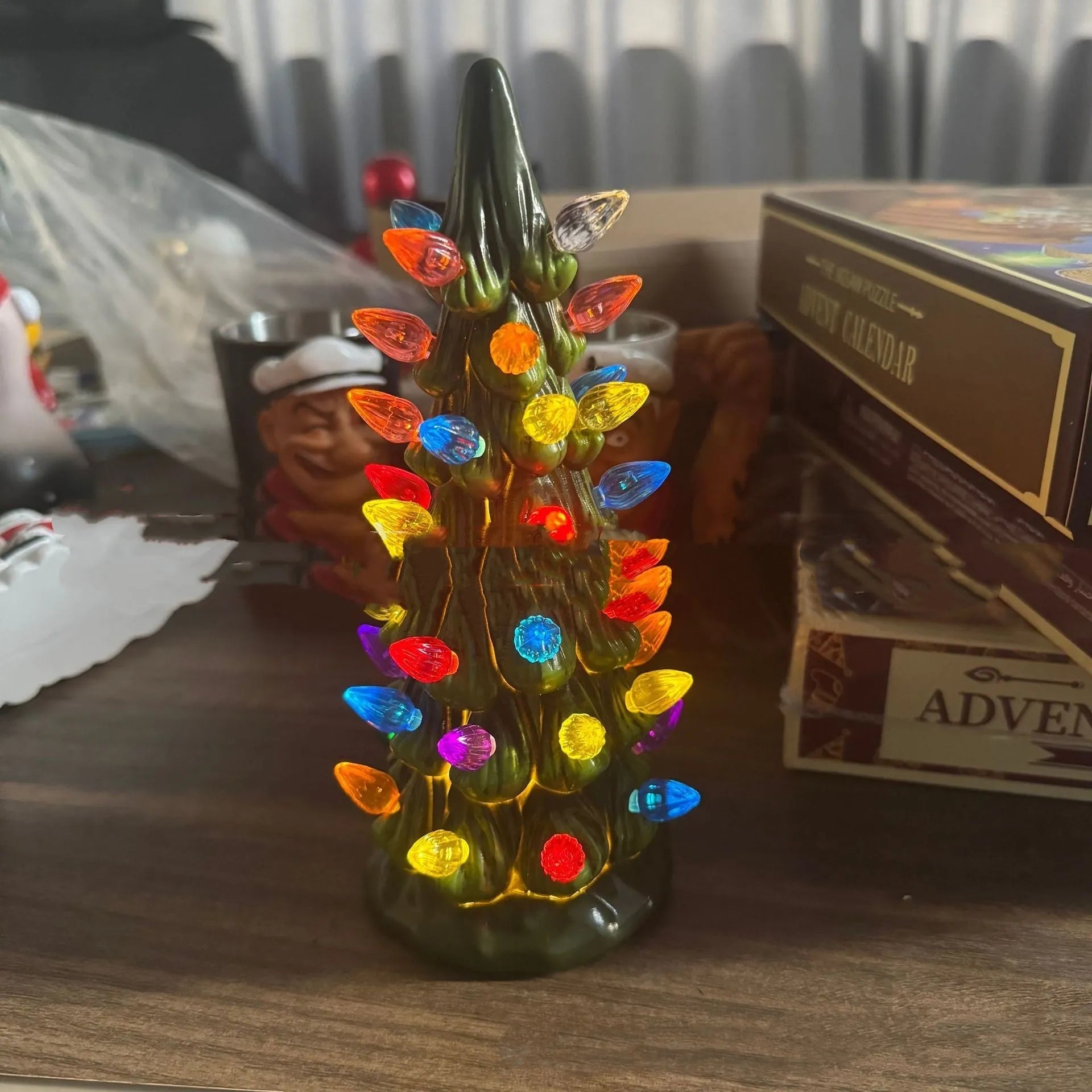 European style resin Christmas tree ornament with LED lights in coloured or warm white, shown in 20cm, 25cm, and 30cm sizes.