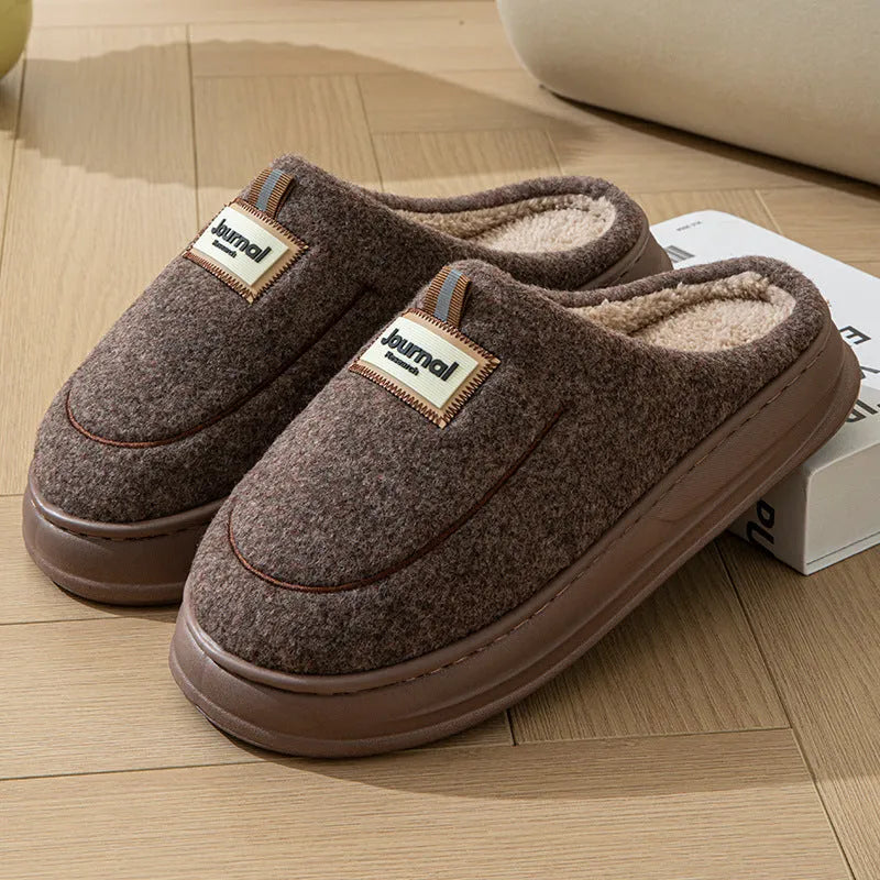 Men's brown and grey suede slippers with a thickened sole, shown from the side.