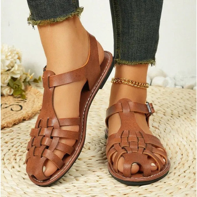 Dark brown women's vintage weave roman sandals with closed toe and buckle fastening on a soft rubber sole.