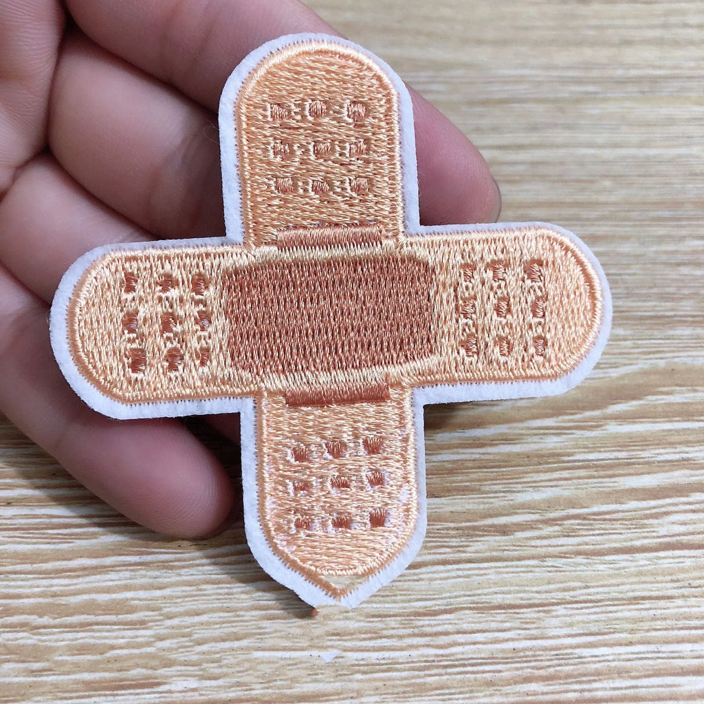 Ten computer embroidered patch badges with full embroidery and lace craft detailing for clothing customisation
