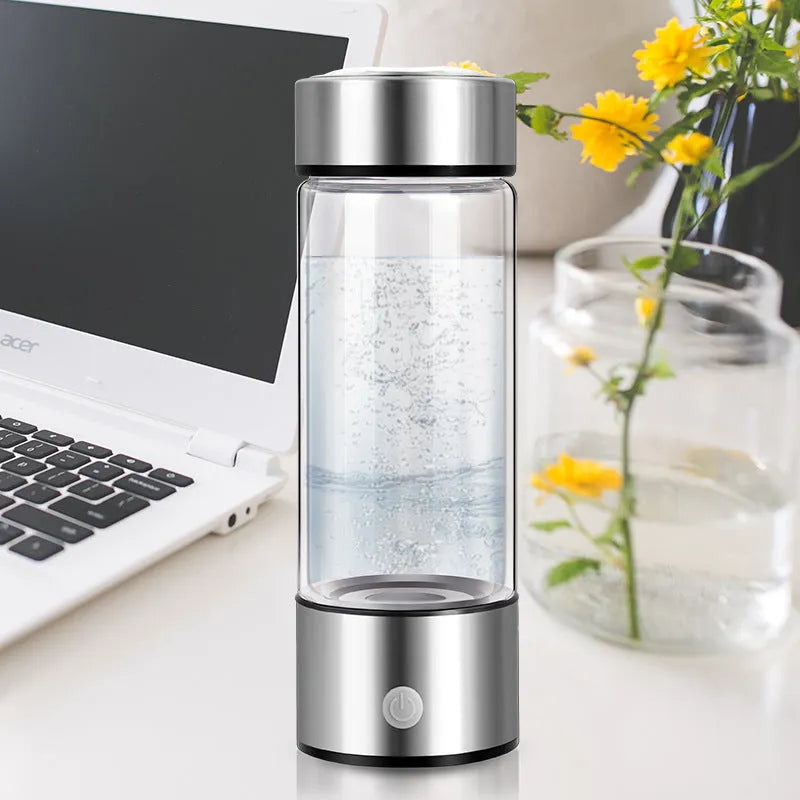 Silver electric hydrogen water generator bottle with borosilicate glass cylindrical design