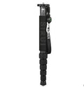 Black carbon fibre six-section SLR camera monopod extended to full height.