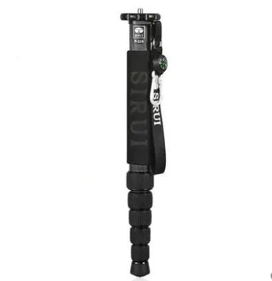 Black carbon fibre six-section SLR camera monopod extended to full height.
