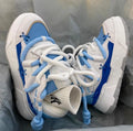 Women's thick sole grey retro sneakers with lace-up front and chunky rubber heel.