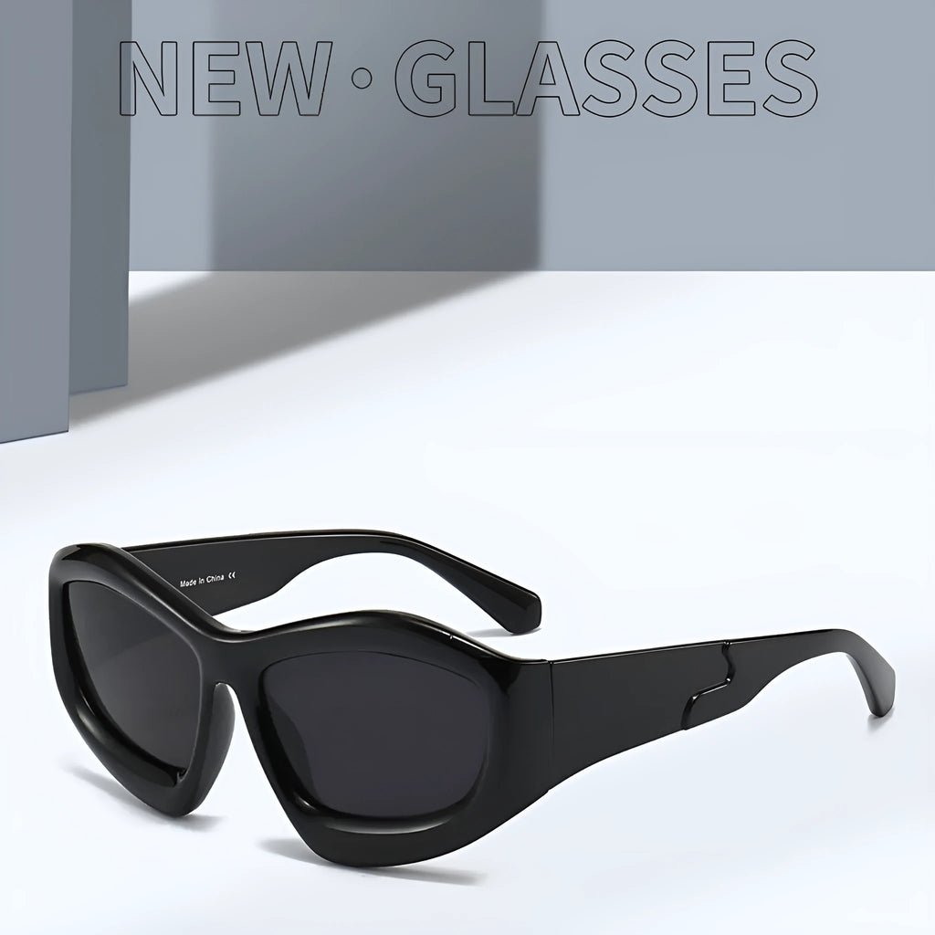 Concave shape sunglasses with bubble lens in multiple colour combinations including black, blue, red and yellow.