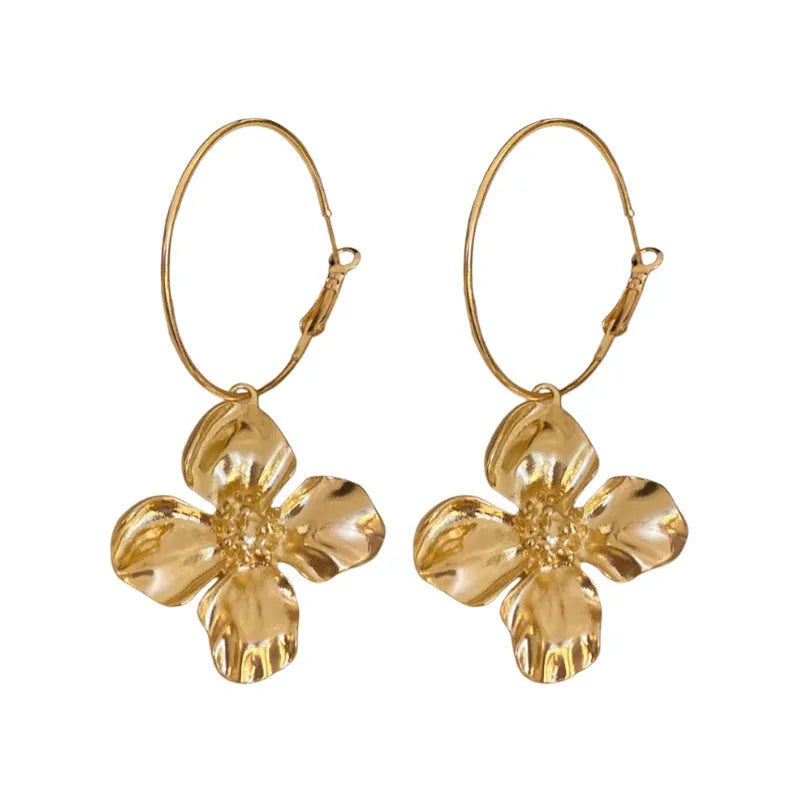 Geometric metal flower earrings with silver needle detail in gold or silver electroplated finish.