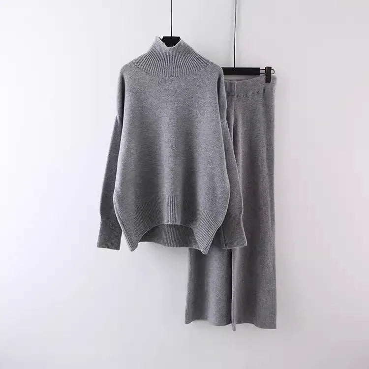 Women's beige acrylic fibre sweater and wide-leg trousers two-piece set on a hanger.