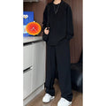 Men's black casual two-piece suit with long sleeve polo shirt and slim fit trousers