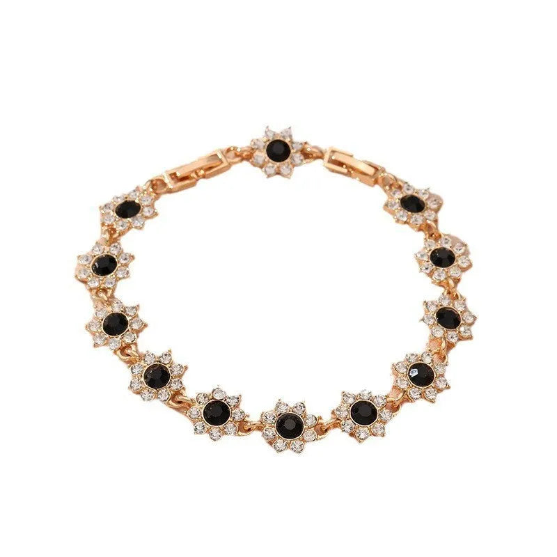 Flower-shaped zinc alloy bracelet with electroplated finish and decorative stone details