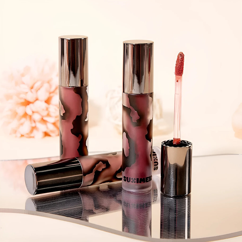 Matte lip mud lipstick tube in one of five shades: orange brown coffee, cool grey, cinnamon coffee, jujube red, or smoked purple.