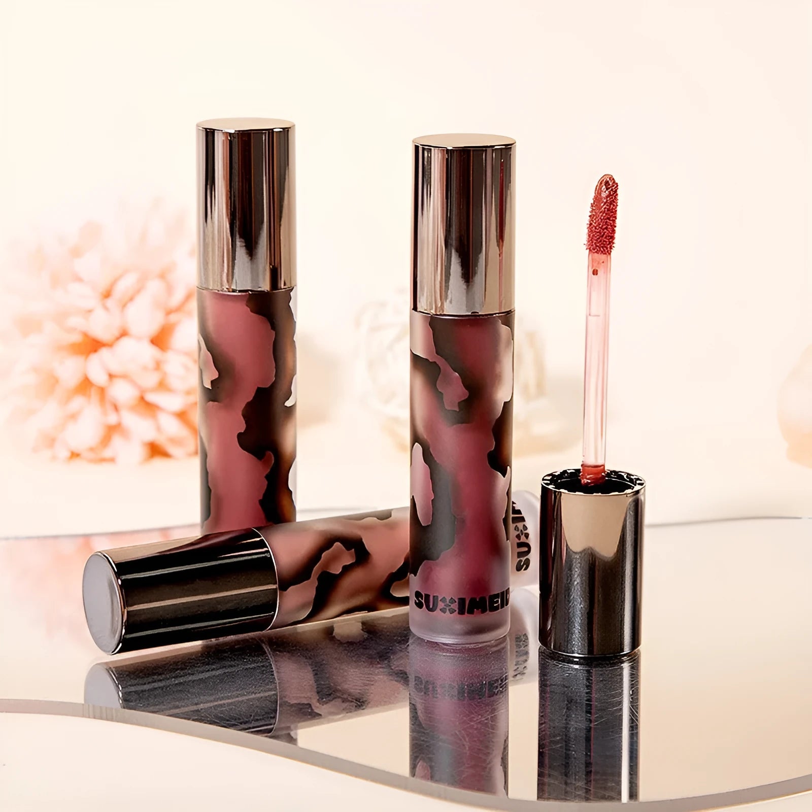 Matte lip mud lipstick tube in one of five shades: orange brown coffee, cool grey, cinnamon coffee, jujube red, or smoked purple.