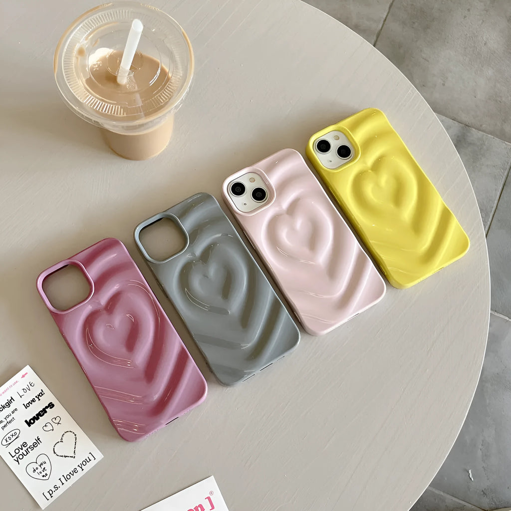 Solid colour TPU iPhone case with a raised 3D love design in bright purple.