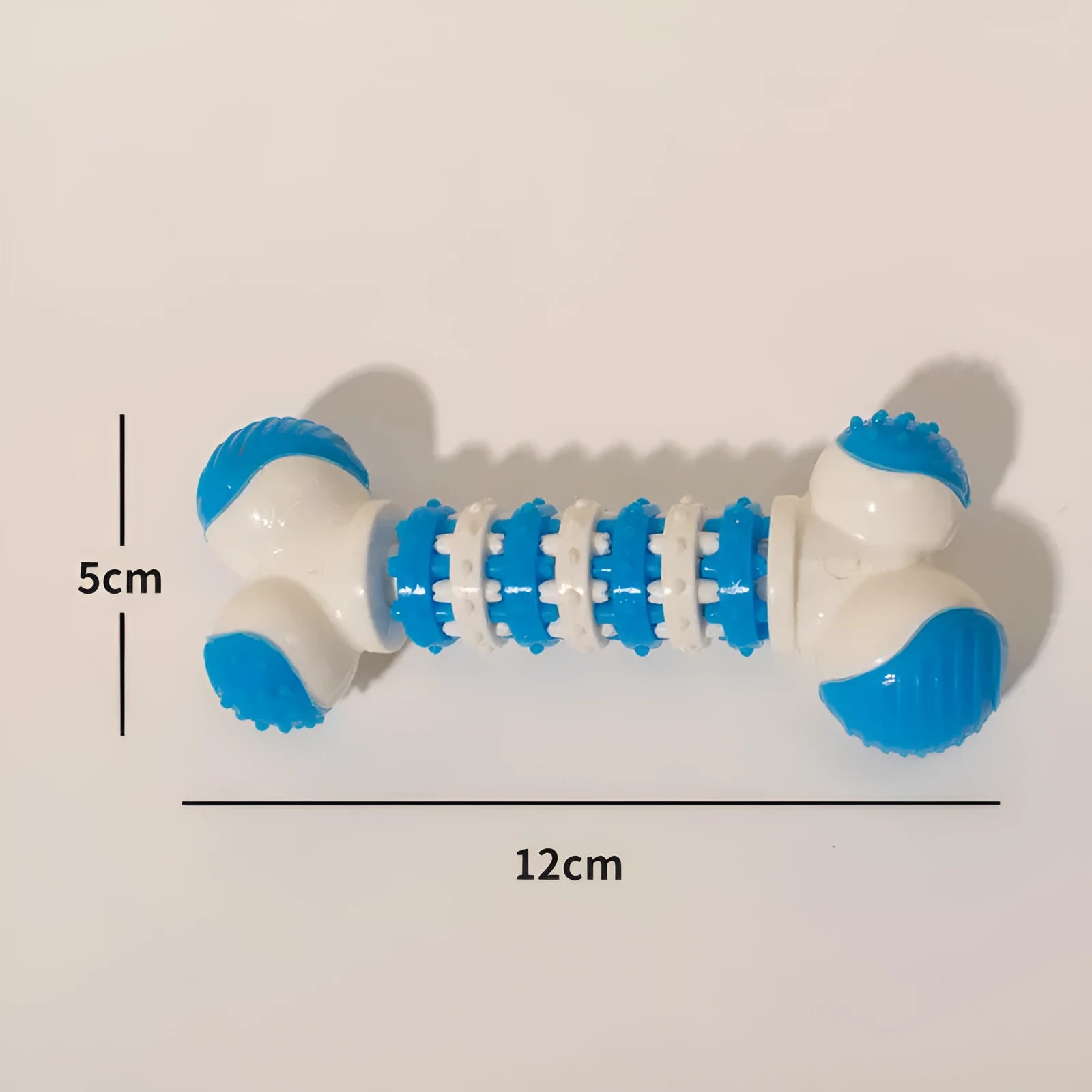 Blue bone-shaped rubber dog chew toy with a treat holder pocket in the centre for small dogs.